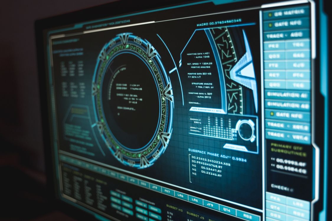 Close-up of a monitor displaying cyber security code and traffic data
